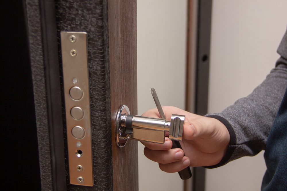 Lock rekey service — close-up of a cylinder being rekeyed