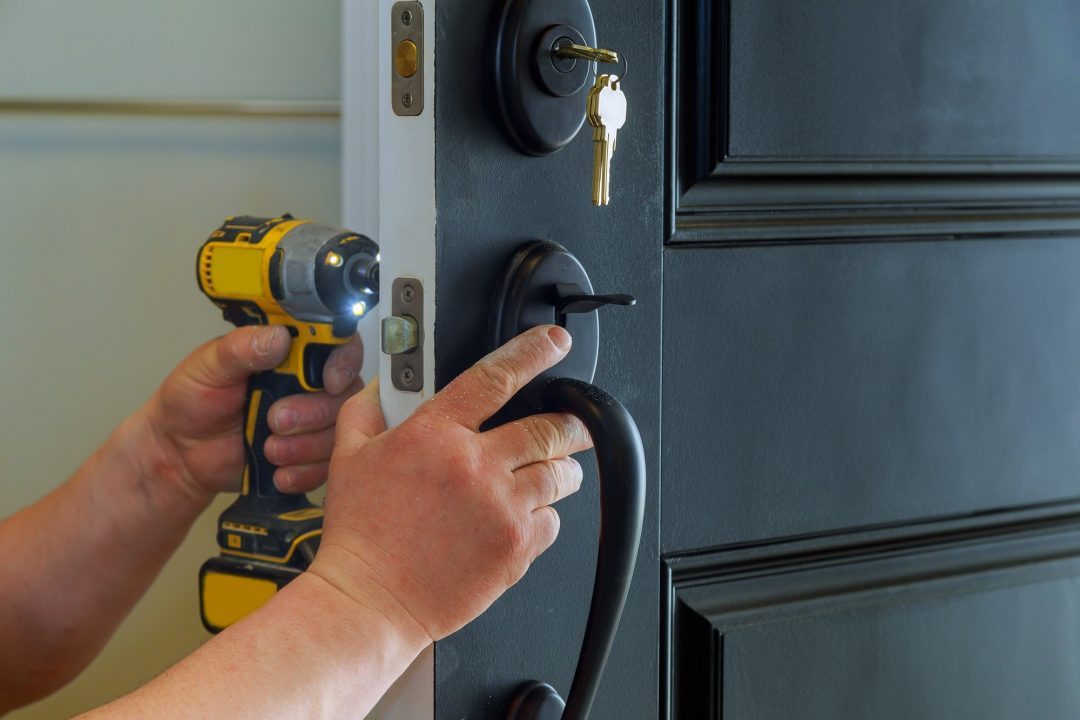 House lockout — locksmith working on a residential door